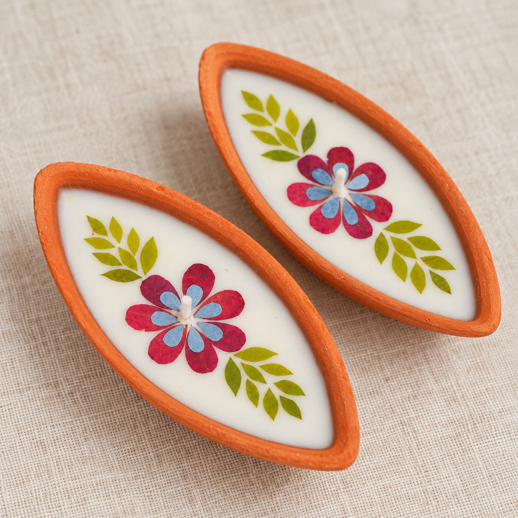 Boat-Shaped Pressed-Flower Terracotta Diyas, close-up of the pressed flowers