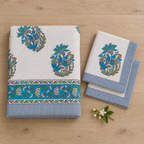 Teal Blue Floral Bedsheet Set, folded with its pillow covers