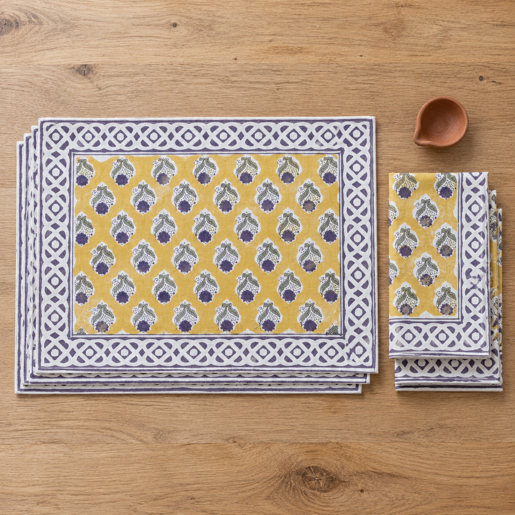 Mustard Floral Placemat and Napkin Set of 12, placemats and napkins stacked, seen from above