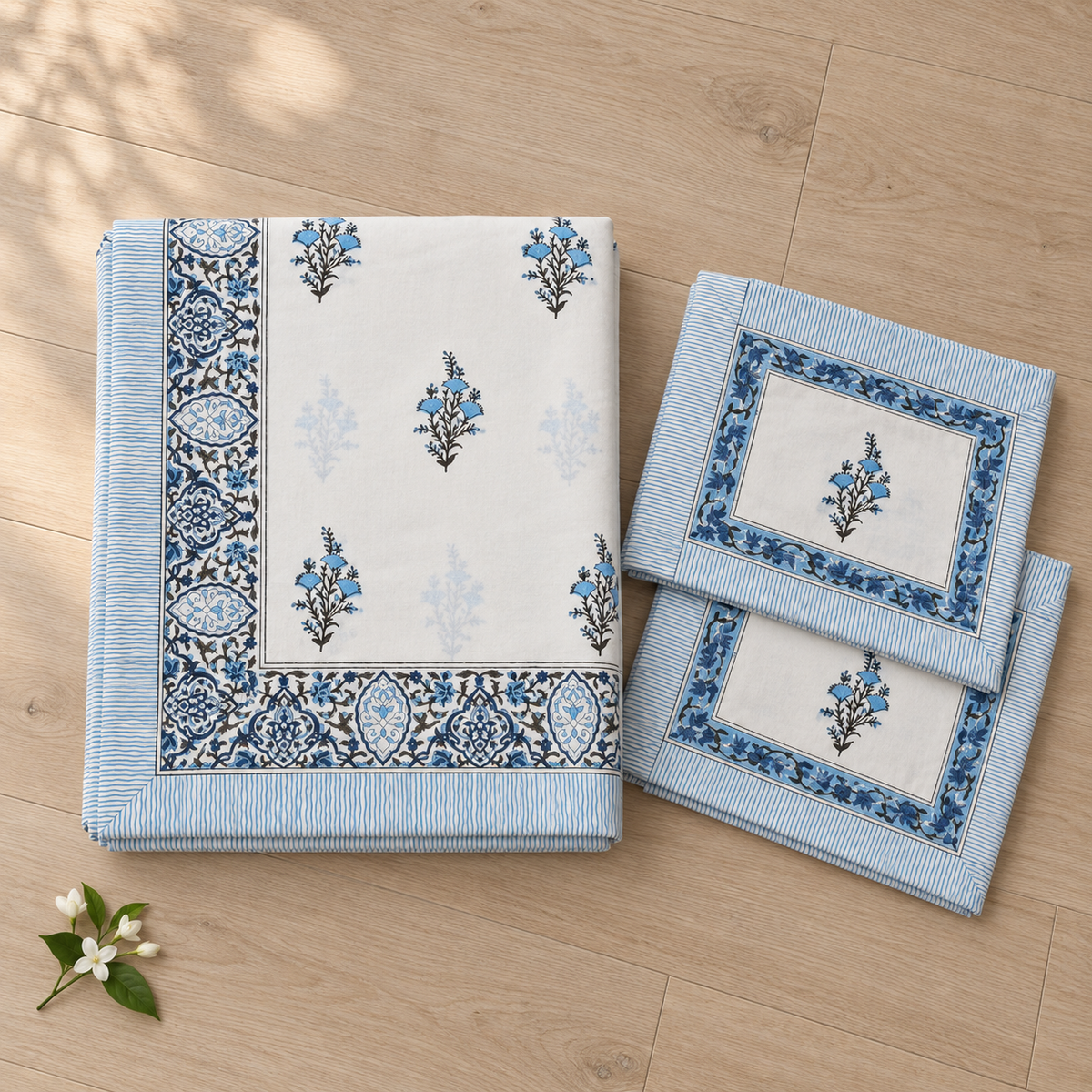 Blue Floral Buta Bedsheet Set, folded with its pillow covers