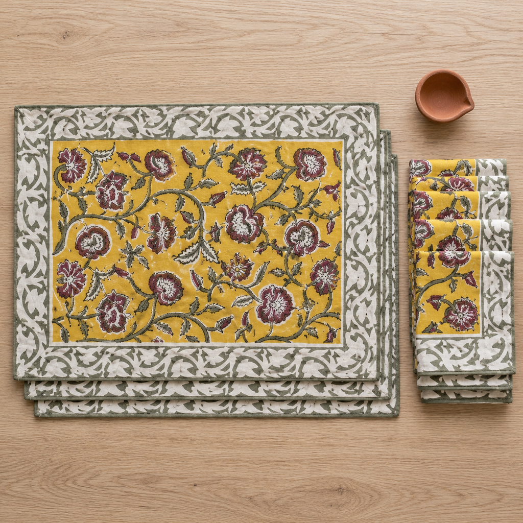 Turmeric Yellow Floral Placemat and Napkin Set of 12, placemats and napkins stacked, seen from above