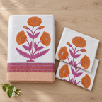 Orange Poppy Bedsheet Set, folded with its pillow covers