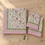 Pink and Green Floral Bedsheet Set, folded with its pillow covers