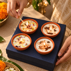 Floral and Spice Soy Wax Diya Gift Hamper, Set of 4, being lit by hand