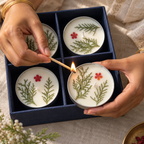 Lemongrass Soy Wax Tin Candles with Dried Flowers, Set of 4, being lit by hand