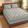 Green and Blue Floral Bedsheet Set, on a made double bed in a bright bedroom
