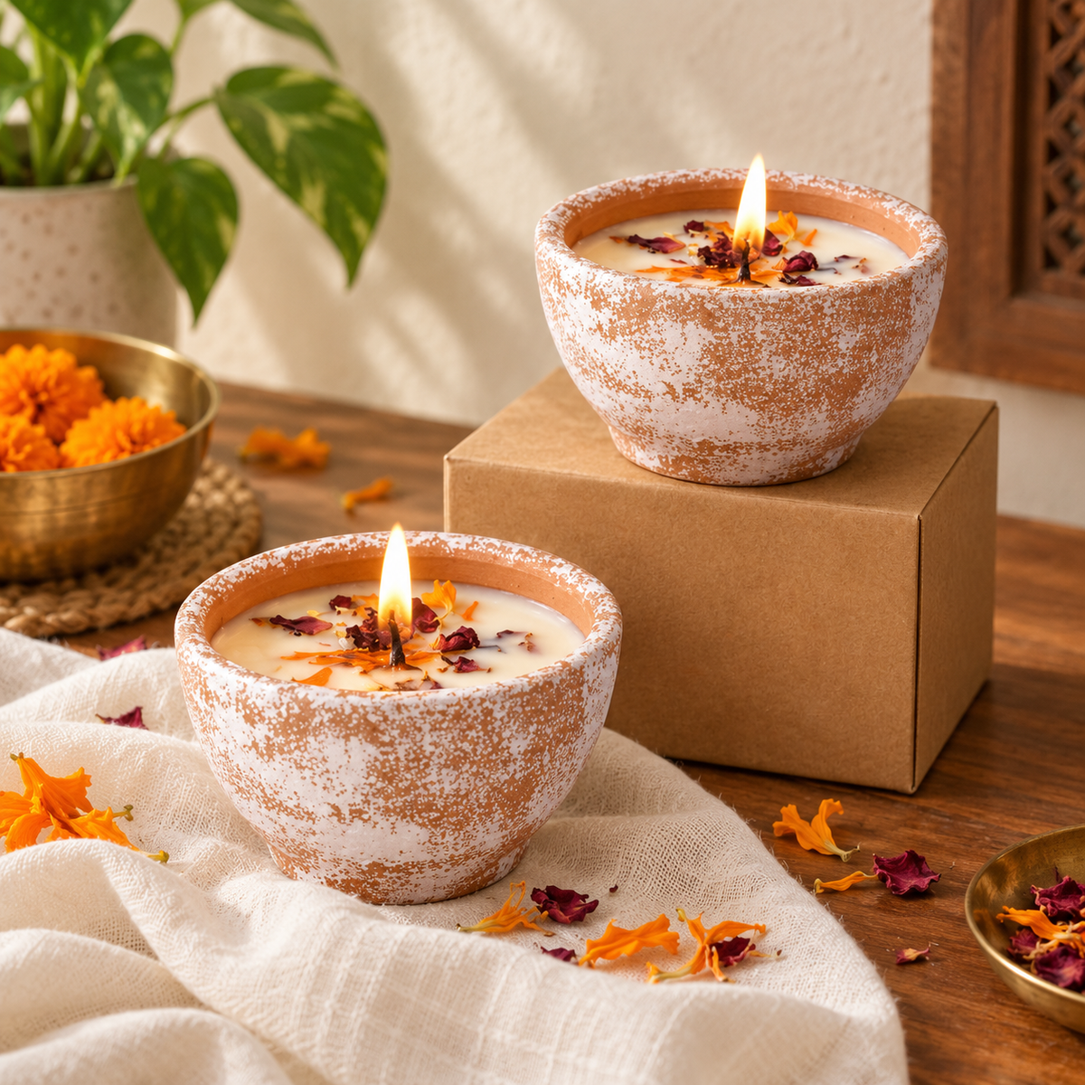 Gratitude Candle in a White-Glazed Terracotta Pot, on a teak console in daylight