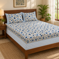 Blue Zigzag Floral Bedsheet Set, on a made double bed in a bright bedroom