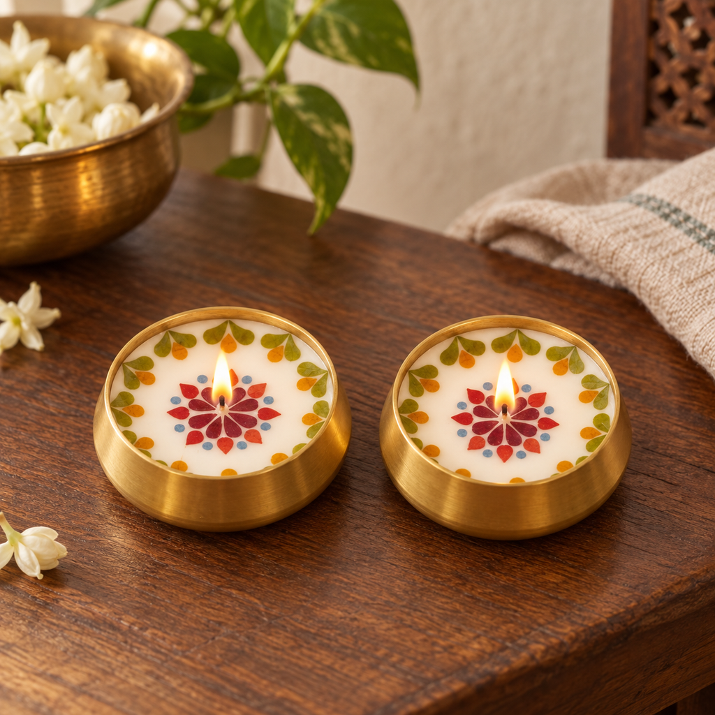 Pressed-Flower Brass Urli Candles, Set of 2, on a teak console in daylight