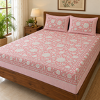 Pink Floral Jaal Bedsheet Set, on a made double bed in a bright bedroom