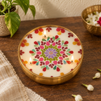 Mandala Soy Wax Candle in a Brass Urli, 5 in, on a teak console in daylight