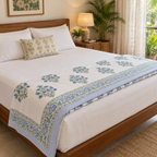 Blue Floral Bunch Dohar, folded at the foot of a made bed