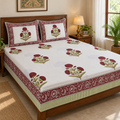 Maroon Floral Buta Bedsheet Set, on a made double bed in a bright bedroom