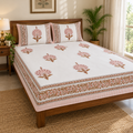 Pink Peacock Motif Bedsheet Set, on a made double bed in a bright bedroom
